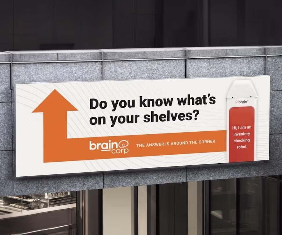 A BrainCorp directional trade show sign